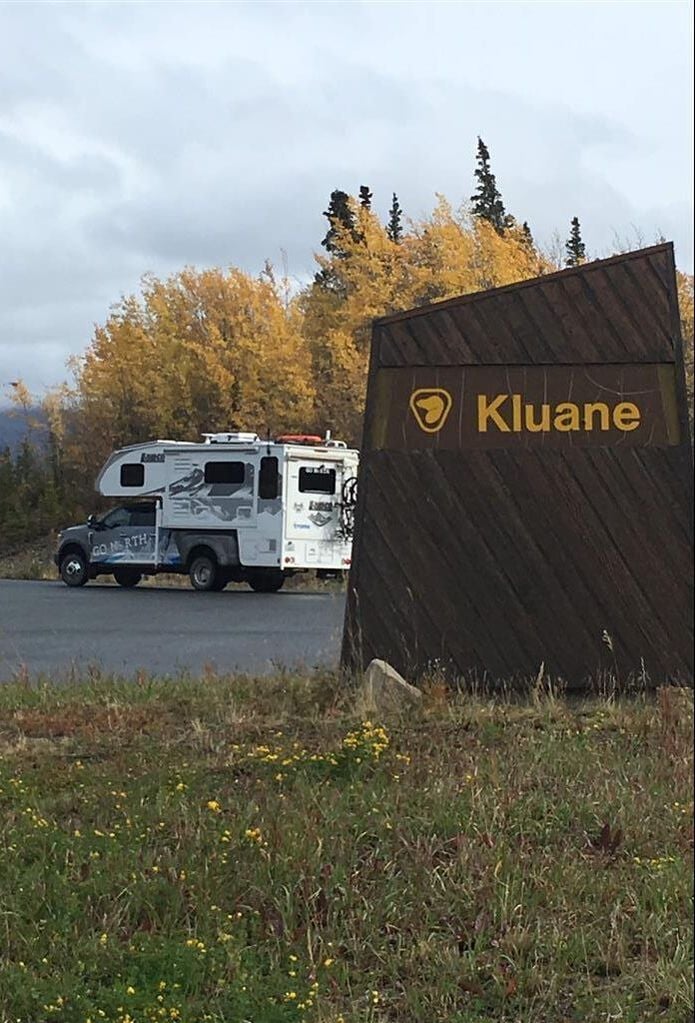 go north truck camper at kluane national park sign