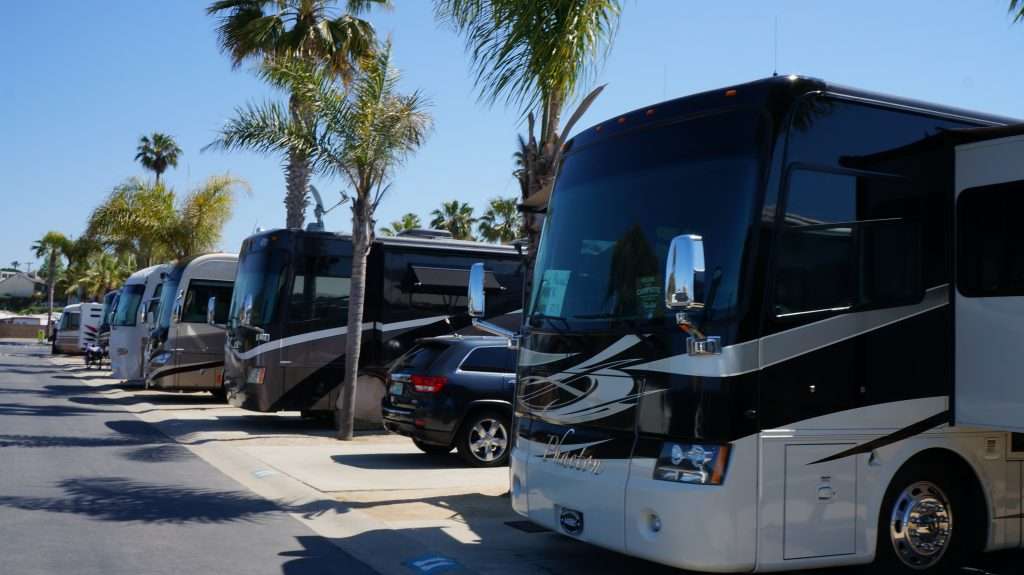 RV parking lot with all vehicles with tinted windows.