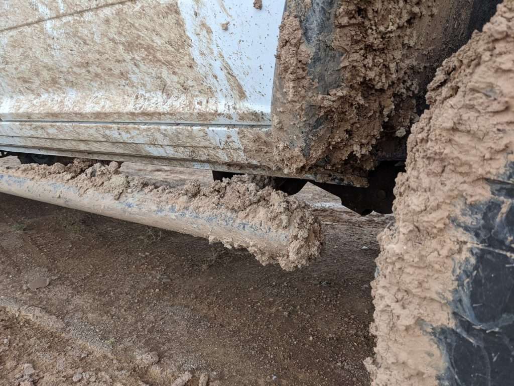 truck covered with mud due to lack of mud flaps