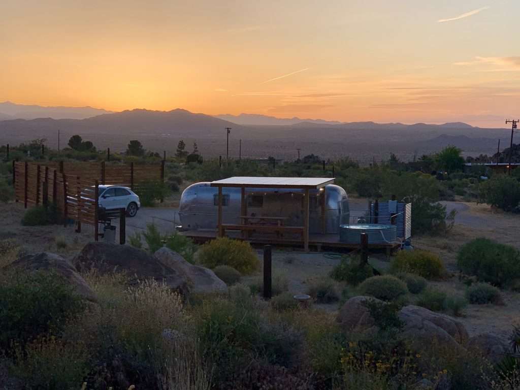 Airstream campsite in desert.